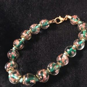 Green and gold bead bracket.